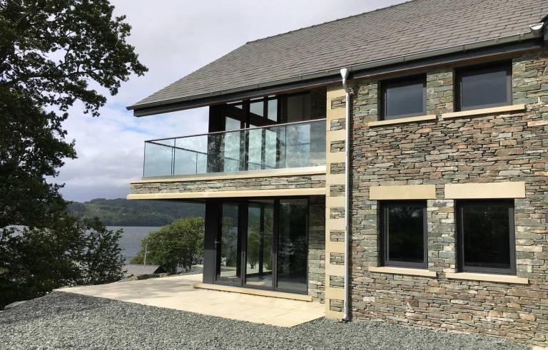 bifolding doors with view over Lake Windermere in the Lake District Cumbria