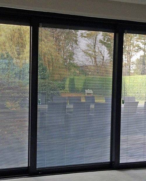 Integral blinds to screen off the glazing and suit the clean design of this Wakefield home