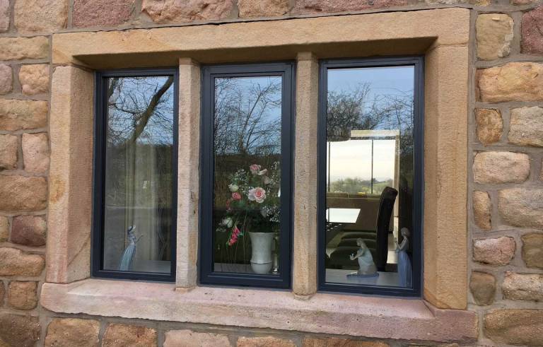Smart Alitherm Heritage aluminium windows Installed in Lancashire between period feature stone mullions replacing crittal steel windows.