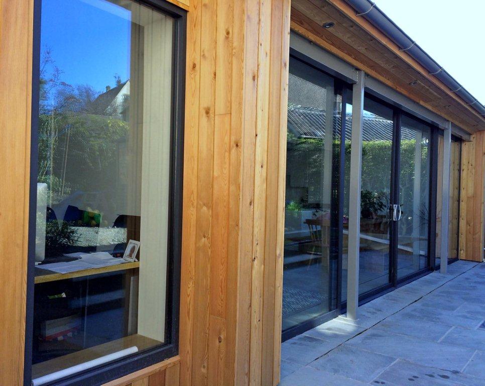 Pushing the design boundaries at Marlin – a sleek combination of aluminium glazing products working in perfect harmony with a solid oak timber door.