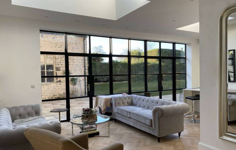 Interior view of Smart Alitherm Heritage aluminium French Doors and windows at Stamford, Rutland.