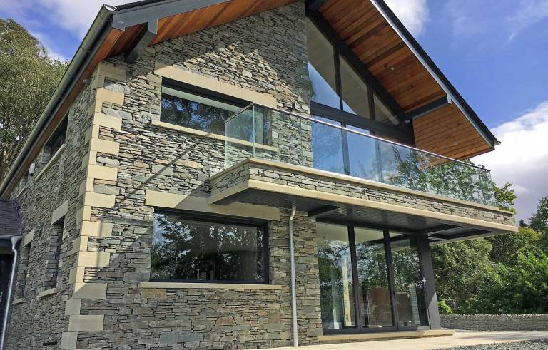 front view of contemporary new build at Lake Windermere in the Lake District Cumbria