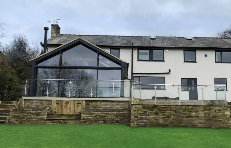 full height angled feature windows installed at detached house in Ilkley in Yorkshire