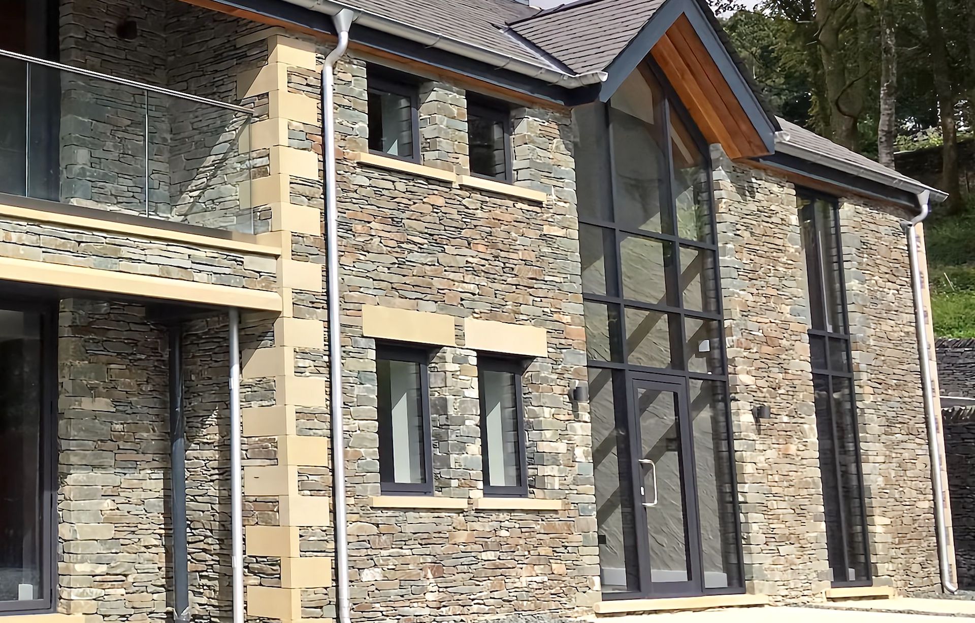 floor to ceiling feature windows installed in large 'grand design' style new build property in the Lake District, Cumbria