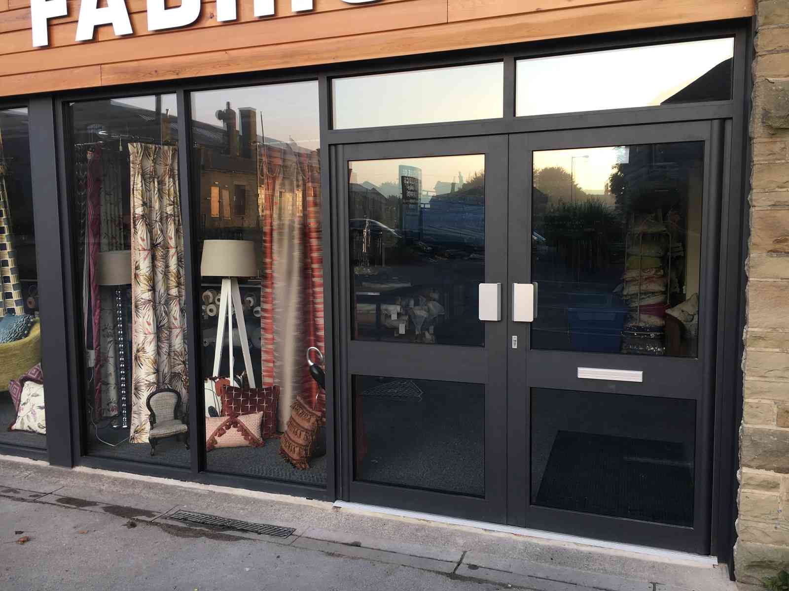 New secure aluminium shopfront double doors at commercial property Saltaire, Shipley in West Yorkshire