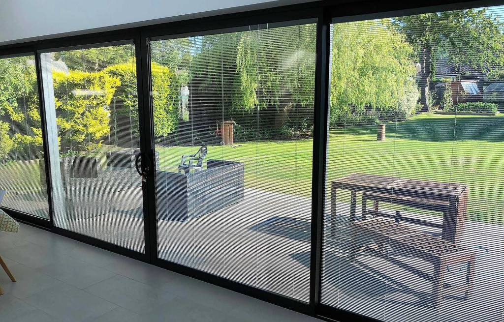 Large aluminium sliding doors with integral blinds