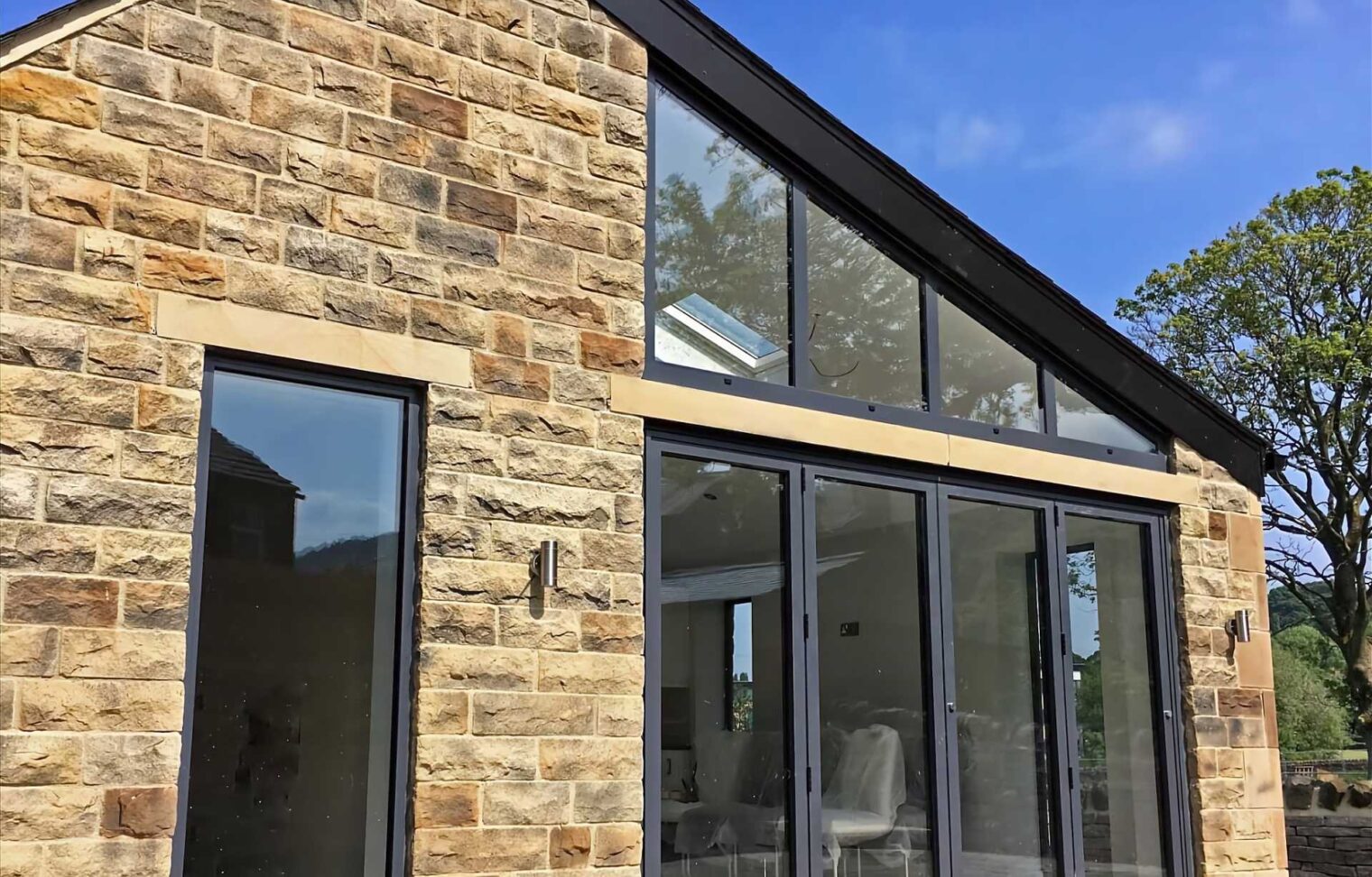 Aluminium bifolding doors and feature glazing